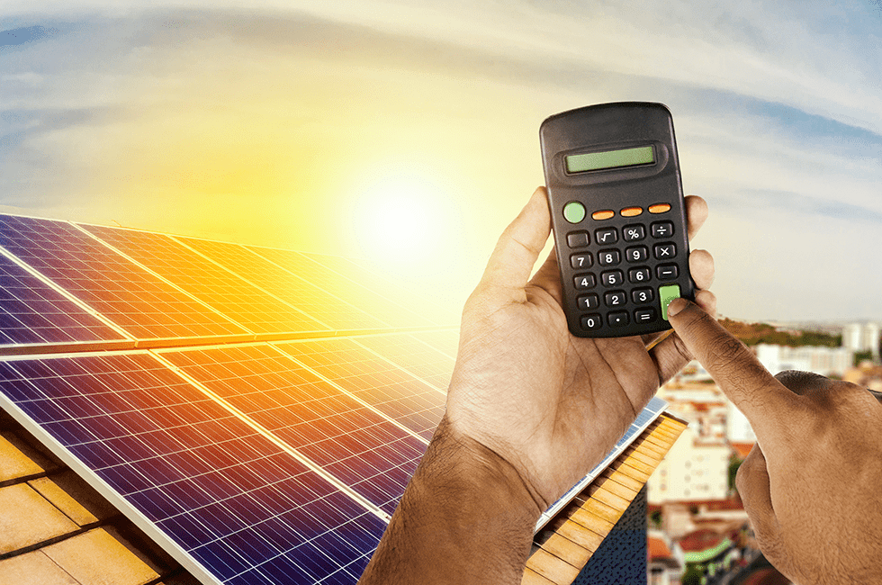 First-person point of view of someone holding a calculator on a roof with solar panels